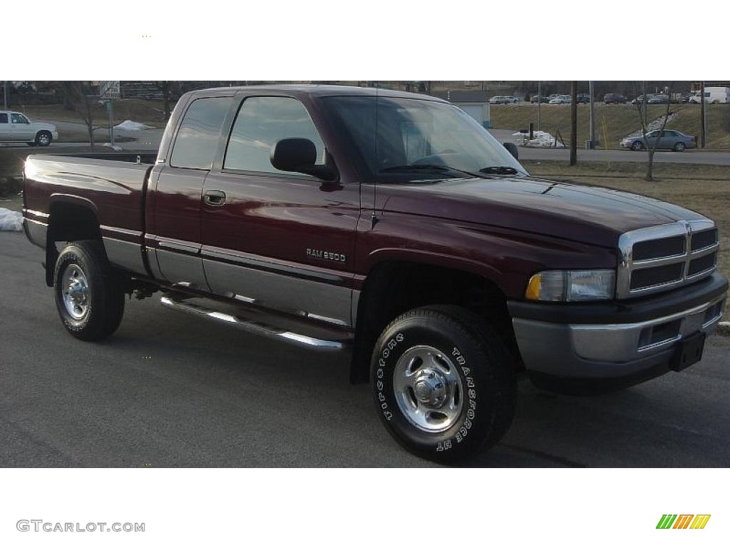 2001 Ram 2500 SLT Quad Cab 4x4 - Dark Garnet Red Pearl / Agate photo #1