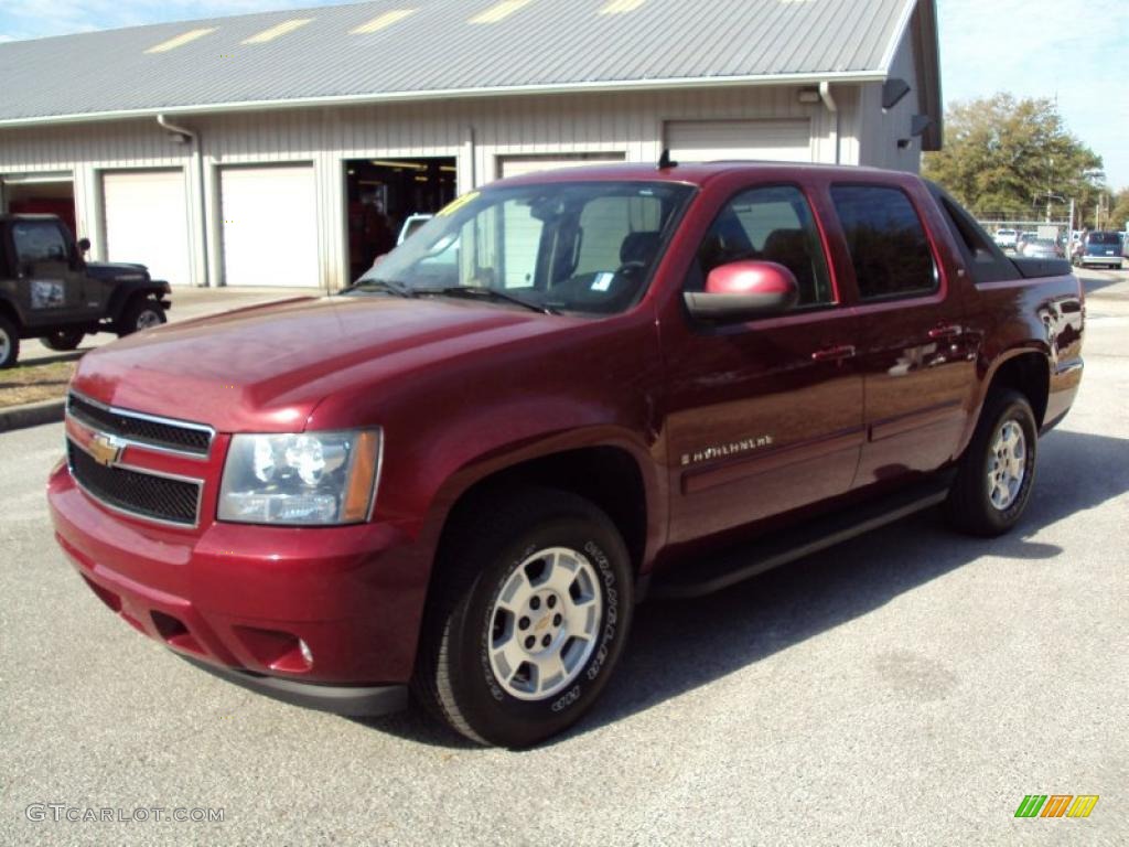 Sport Red Metallic Chevrolet Avalanche. 