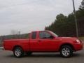 2003 Aztec Red Nissan Frontier XE King Cab  photo #1