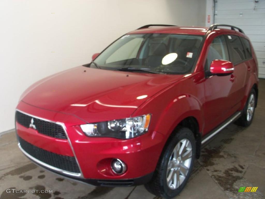 2010 Outlander SE 4WD - Rally Red Metallic / Black photo #1