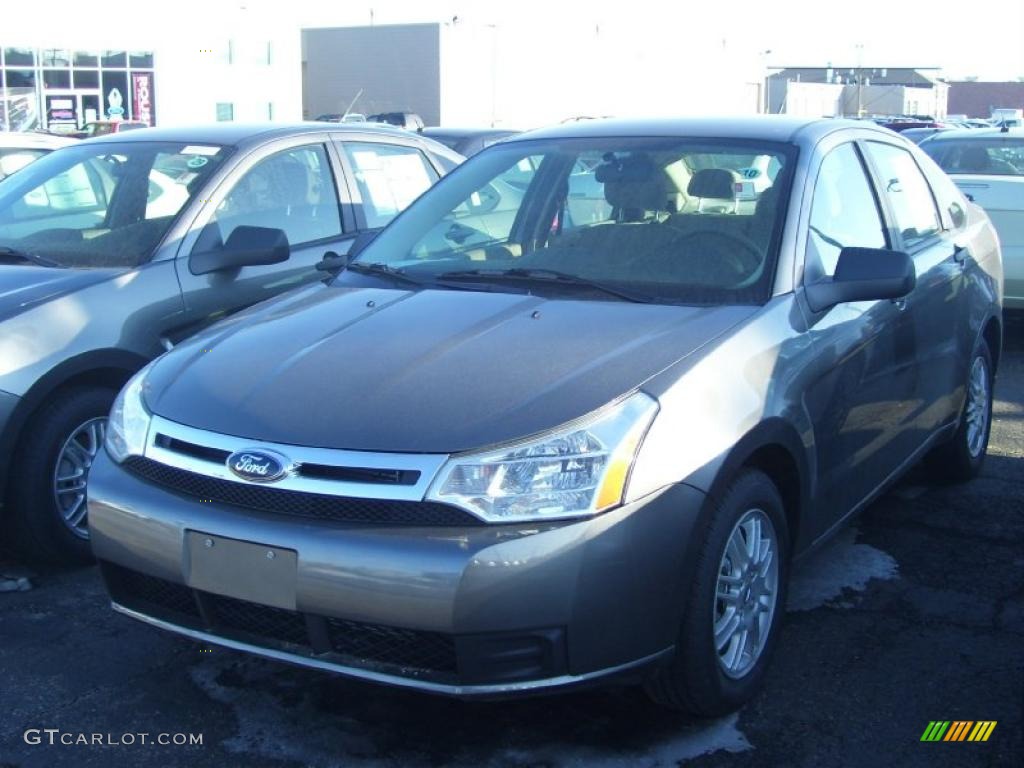 2010 Focus SE Sedan - Sterling Grey Metallic / Medium Stone photo #1