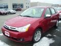 2010 Sangria Red Metallic Ford Focus SEL Sedan  photo #1