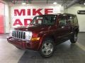 2009 Red Rock Crystal Pearl Jeep Commander Sport  photo #1