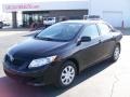 2010 Black Sand Pearl Toyota Corolla LE  photo #2