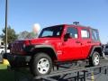 2010 Flame Red Jeep Wrangler Unlimited Sport 4x4  photo #19