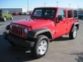 2010 Flame Red Jeep Wrangler Unlimited Sport 4x4  photo #2