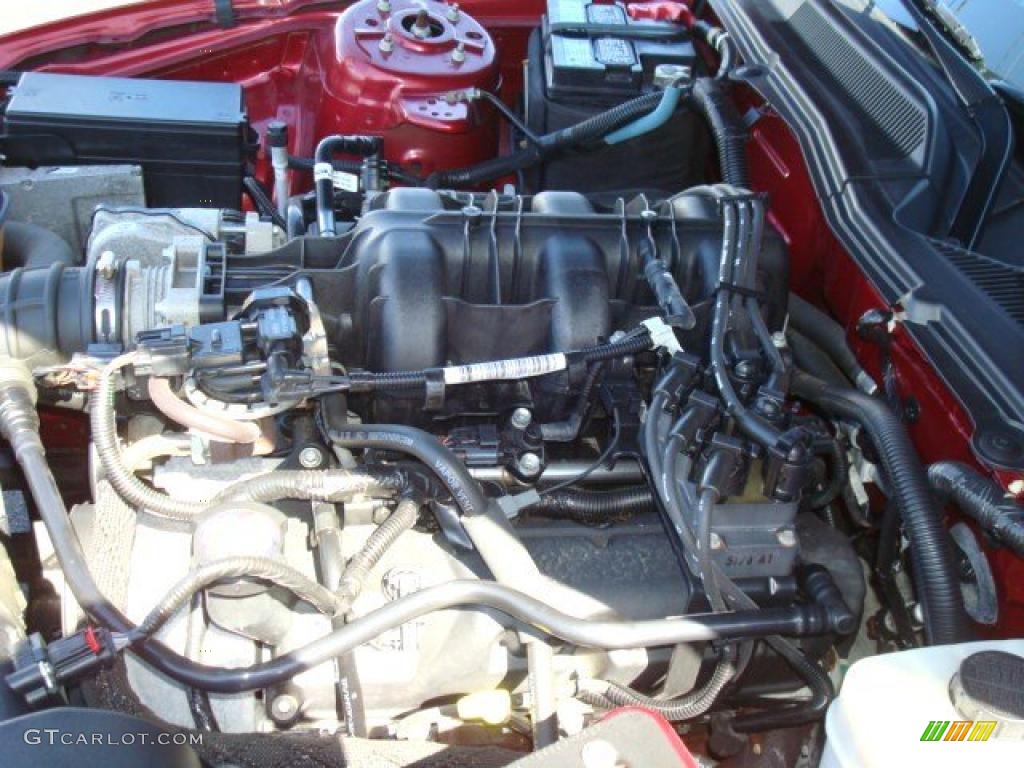 2006 Mustang V6 Premium Coupe - Redfire Metallic / Light Graphite photo #26