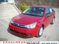 2010 Sangria Red Metallic Ford Focus SE Sedan  photo #2