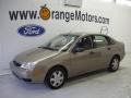 2005 Arizona Beige Metallic Ford Focus ZX4 SE Sedan  photo #1