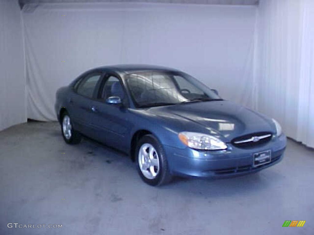 Medium Royal Blue Metallic Ford Taurus