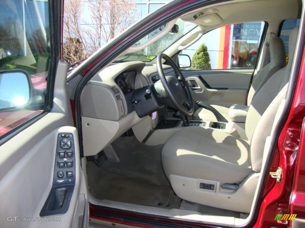 2003 Grand Cherokee Laredo 4x4 - Dark Garnet Red Pearl / Taupe photo #32