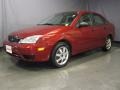 2005 Sangria Red Metallic Ford Focus ZX4 SE Sedan  photo #1