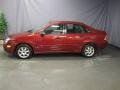 2005 Sangria Red Metallic Ford Focus ZX4 SE Sedan  photo #2