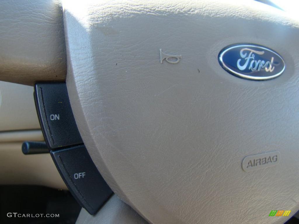2004 Taurus SEL Sedan - Black / Medium Parchment photo #24