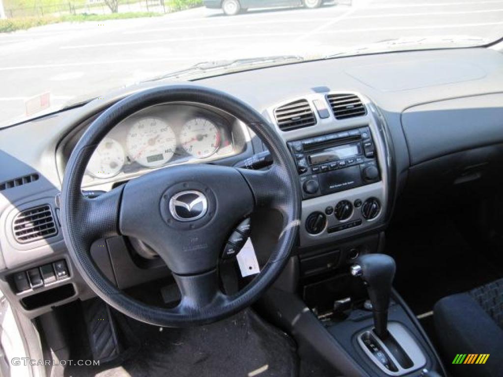 2002 Protege LX - Sunlight Silver Metallic / Off Black photo #6