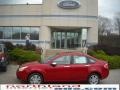 2010 Sangria Red Metallic Ford Focus SEL Sedan  photo #1