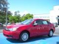 2010 Sangria Red Metallic Ford Focus SE Sedan  photo #1