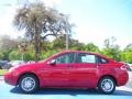 2010 Sangria Red Metallic Ford Focus SE Sedan  photo #2