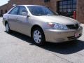 2003 Desert Sand Mica Toyota Camry LE  photo #1