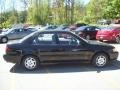 1998 Satin Black Metallic Toyota Corolla LE  photo #17