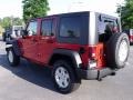 2010 Flame Red Jeep Wrangler Unlimited Sport 4x4  photo #2