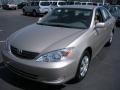 2003 Desert Sand Mica Toyota Camry LE  photo #1