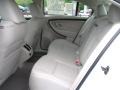 2010 Ford Taurus Light Stone Interior Rear Seat Photo