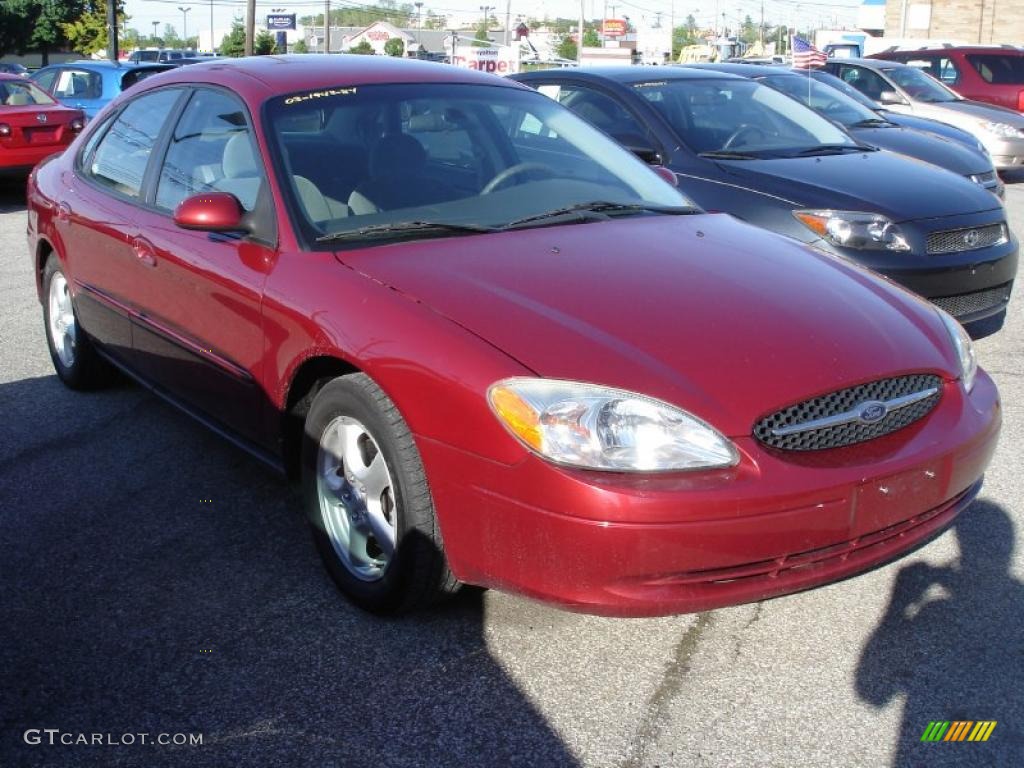 2003 Taurus SE - Matador Red Metallic / Medium Graphite photo #1