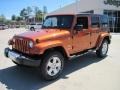 2010 Mango Tango Pearl Jeep Wrangler Unlimited Sahara 4x4  photo #1