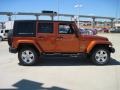 2010 Mango Tango Pearl Jeep Wrangler Unlimited Sahara 4x4  photo #4
