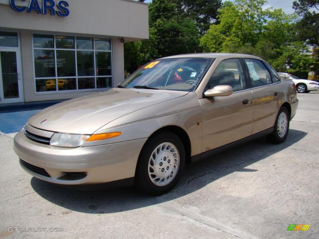 2002 L Series L100 Sedan - Medium Gold / Medium Tan photo #2