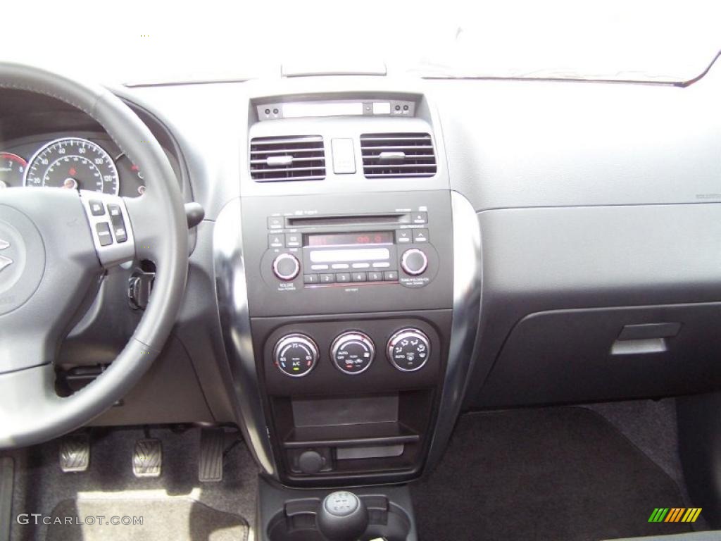 2009 SX4 Touring Sport Sedan - Vivid Red / Black photo #8