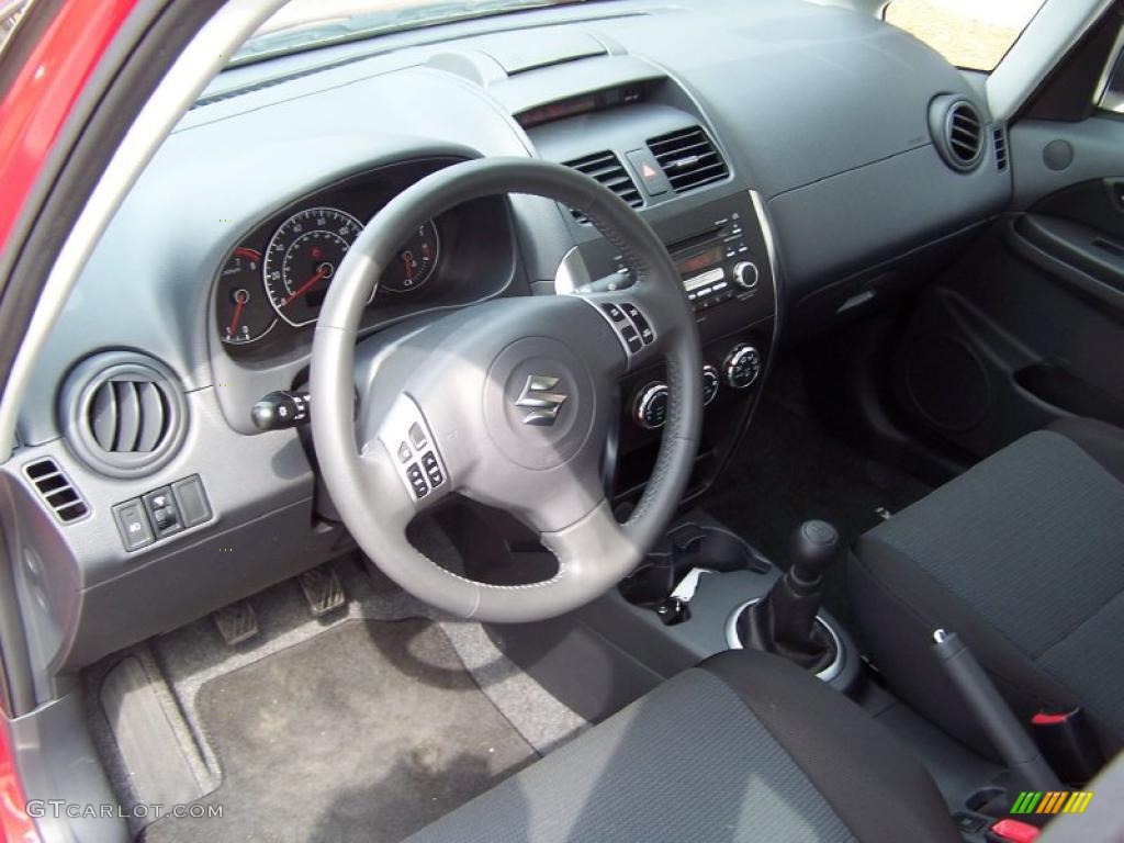 2009 SX4 Touring Sport Sedan - Vivid Red / Black photo #9