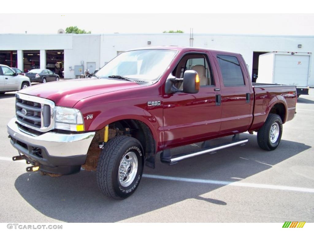 2004 F250 Super Duty Lariat Crew Cab 4x4 - Dark Toreador Red Metallic / Medium Parchment photo #1