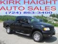 2002 Black Ford F150 XLT SuperCab 4x4  photo #1