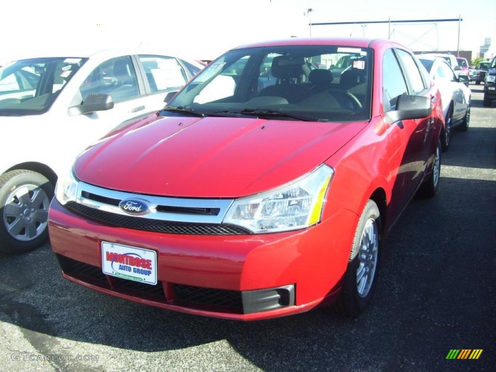 2010 Focus SE Sedan - Sangria Red Metallic / Medium Stone photo #1