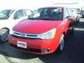2010 Sangria Red Metallic Ford Focus SE Sedan  photo #1