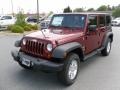 2010 Red Rock Crystal Pearl Jeep Wrangler Unlimited Sport 4x4  photo #1