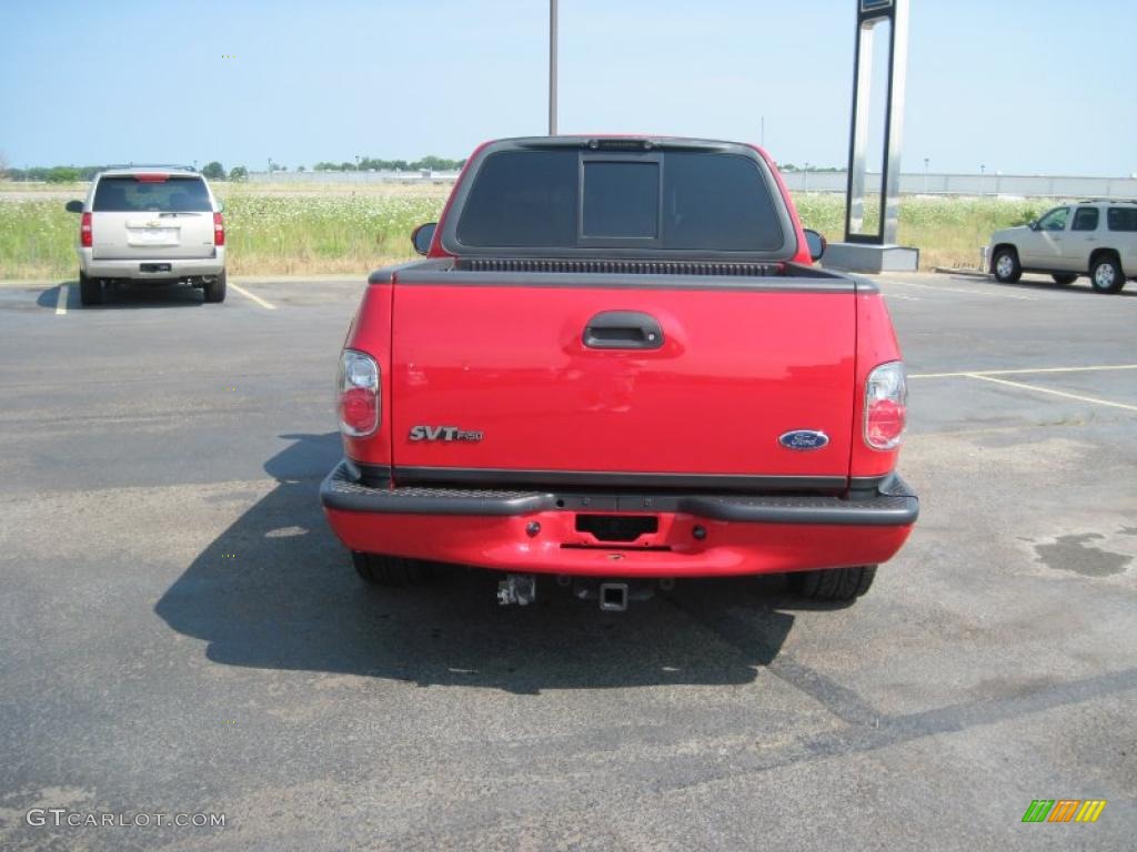 2004 F150 SVT Lightning - Bright Red / SVT Black/Light Flint photo #11