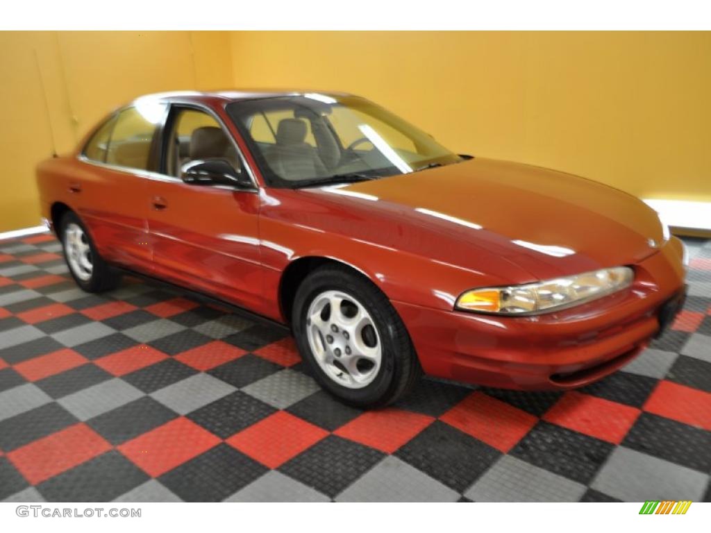 Red Metallic Oldsmobile Intrigue