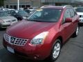 2009 Venom Red Nissan Rogue SL  photo #1