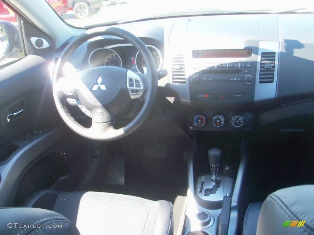 2010 Outlander SE 4WD - Cosmic Blue Metallic / Black photo #27