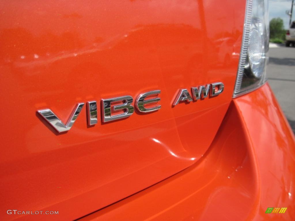 2010 Vibe AWD - Ignition Orange Metallic / Ebony photo #26