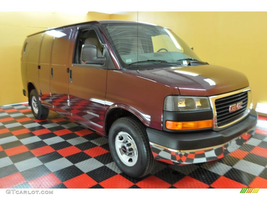 Midnight Red Metallic GMC Savana Van