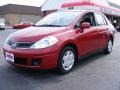 2009 Red Brick Nissan Versa 1.8 S Sedan  photo #1