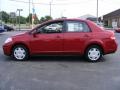 2009 Red Brick Nissan Versa 1.8 S Sedan  photo #2