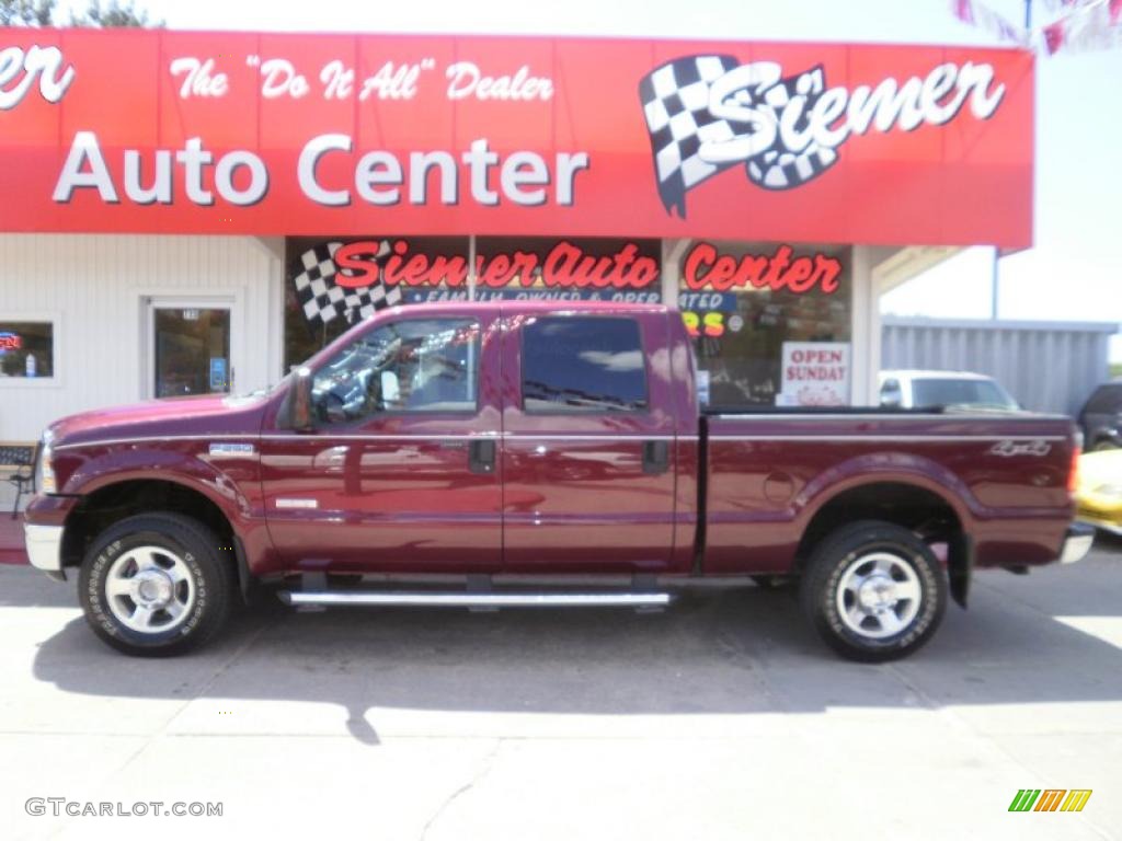 2005 F250 Super Duty Lariat Crew Cab 4x4 - Dark Toreador Red Metallic / Medium Flint photo #1