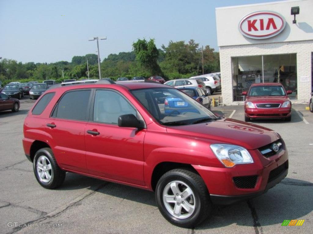 2010 Sportage LX V6 4x4 - Volcanic Red / Beige photo #1