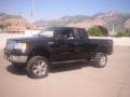 2005 Black Ford F150 XLT SuperCab 4x4  photo #2