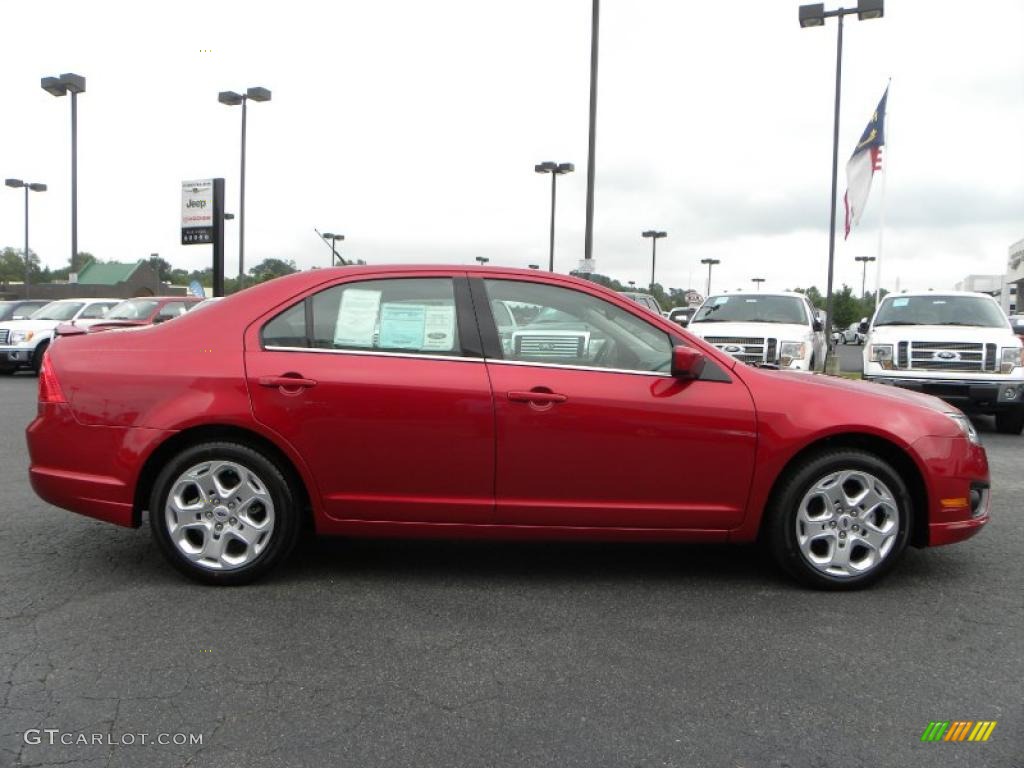 2010 Fusion SE V6 - Red Candy Metallic / Medium Light Stone photo #2